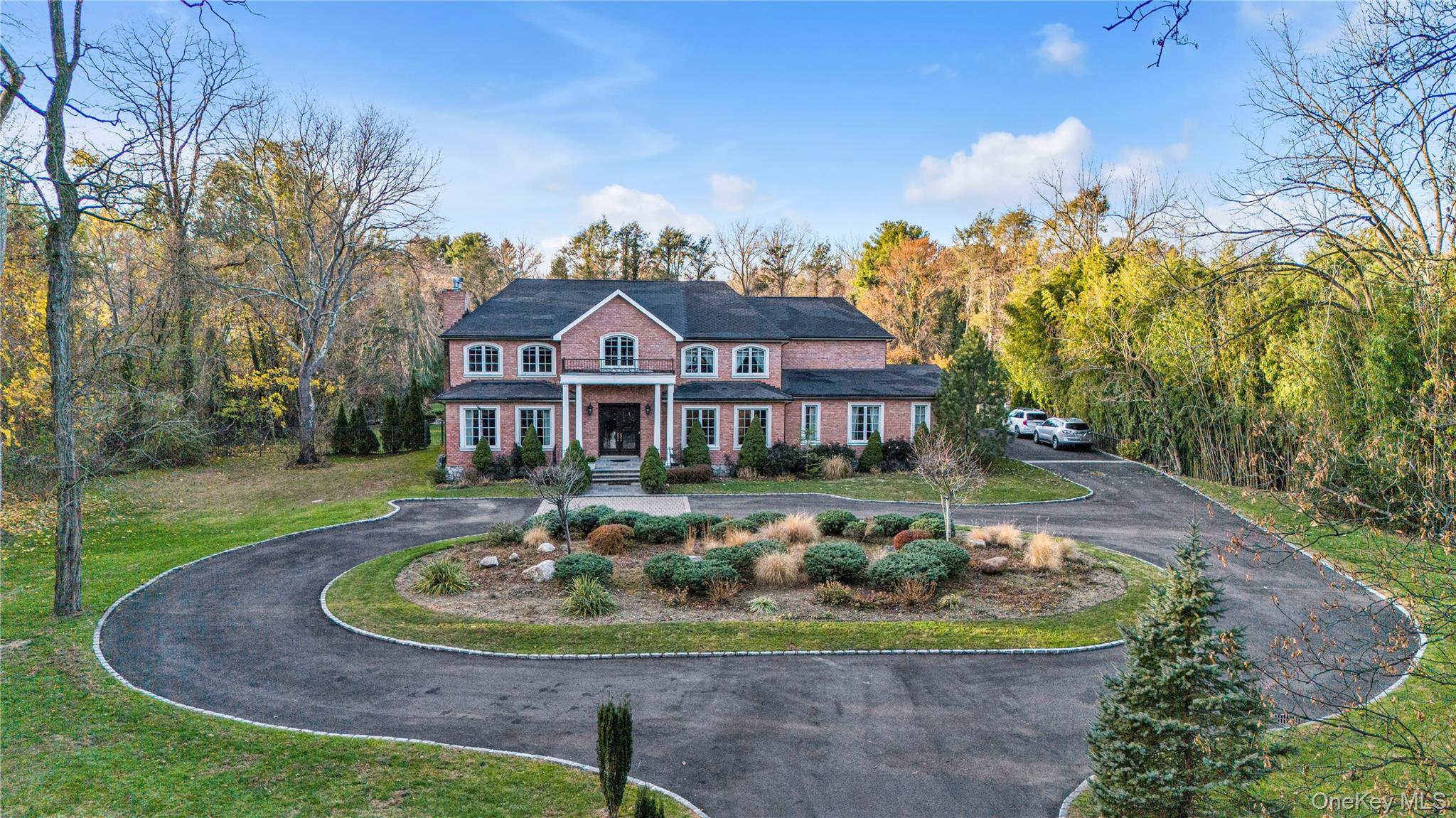 109 Wheatley Road Glen Head, NY 11545 - Photo 40 of 47 a front view of a house with a yard