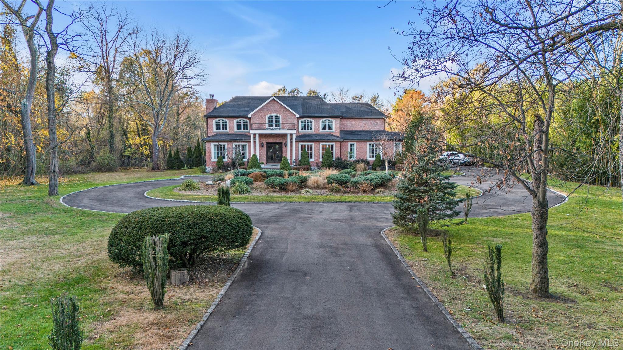 109 Wheatley Road Glen Head, NY 11545 - Photo 41 of 47 a front view of a house with garden