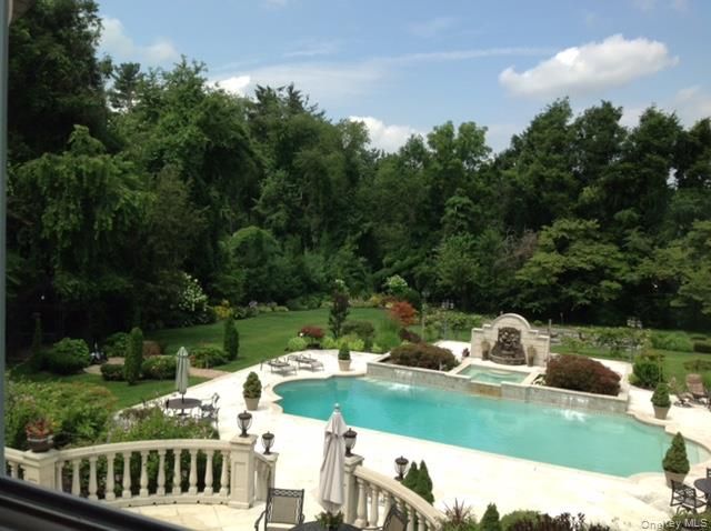 a view of a wooden deck and a yard