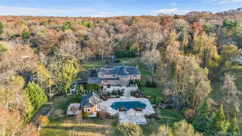 a aerial view of a house with a lake view