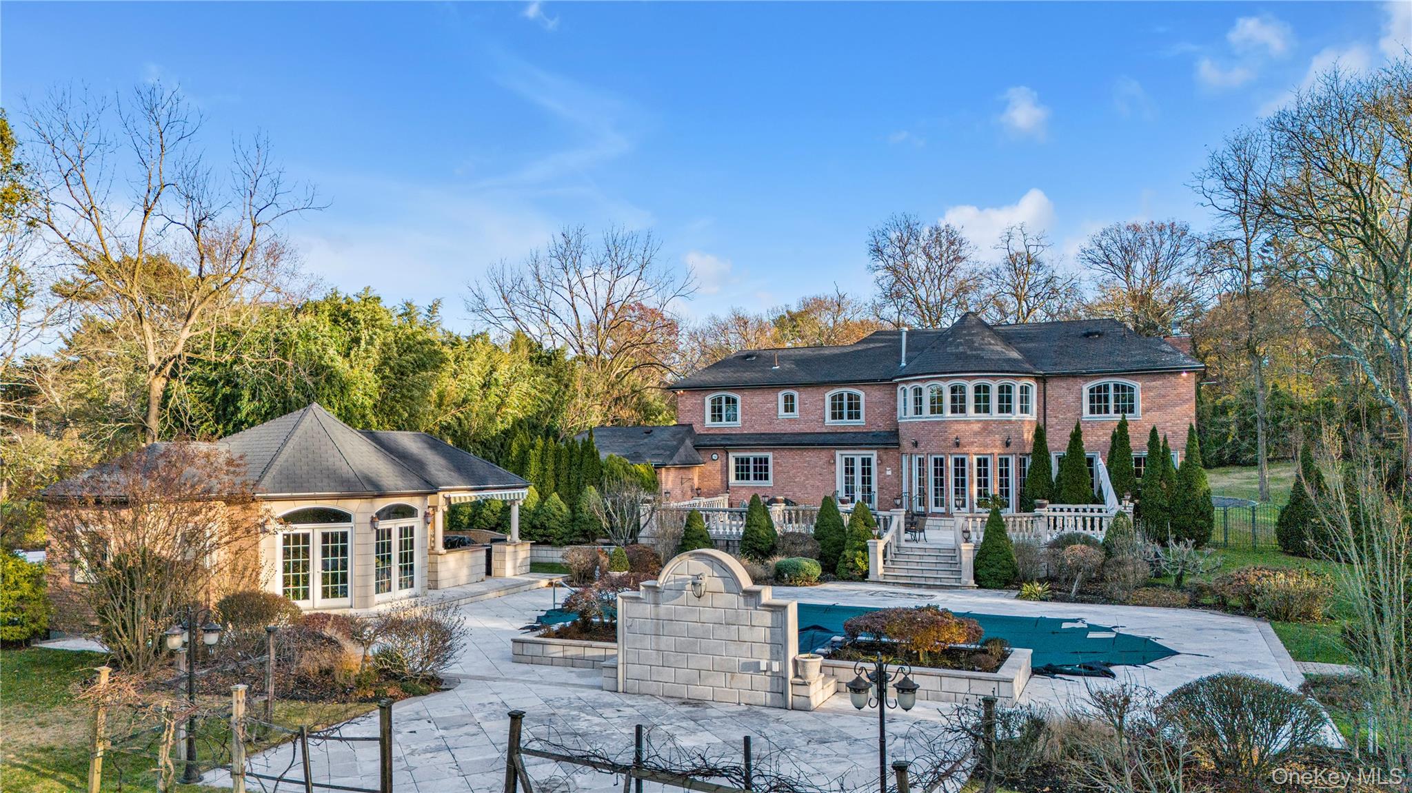 109 Wheatley Road Glen Head, NY 11545 - Photo 9 of 47 a front view of a house with a yard garage and outdoor seating