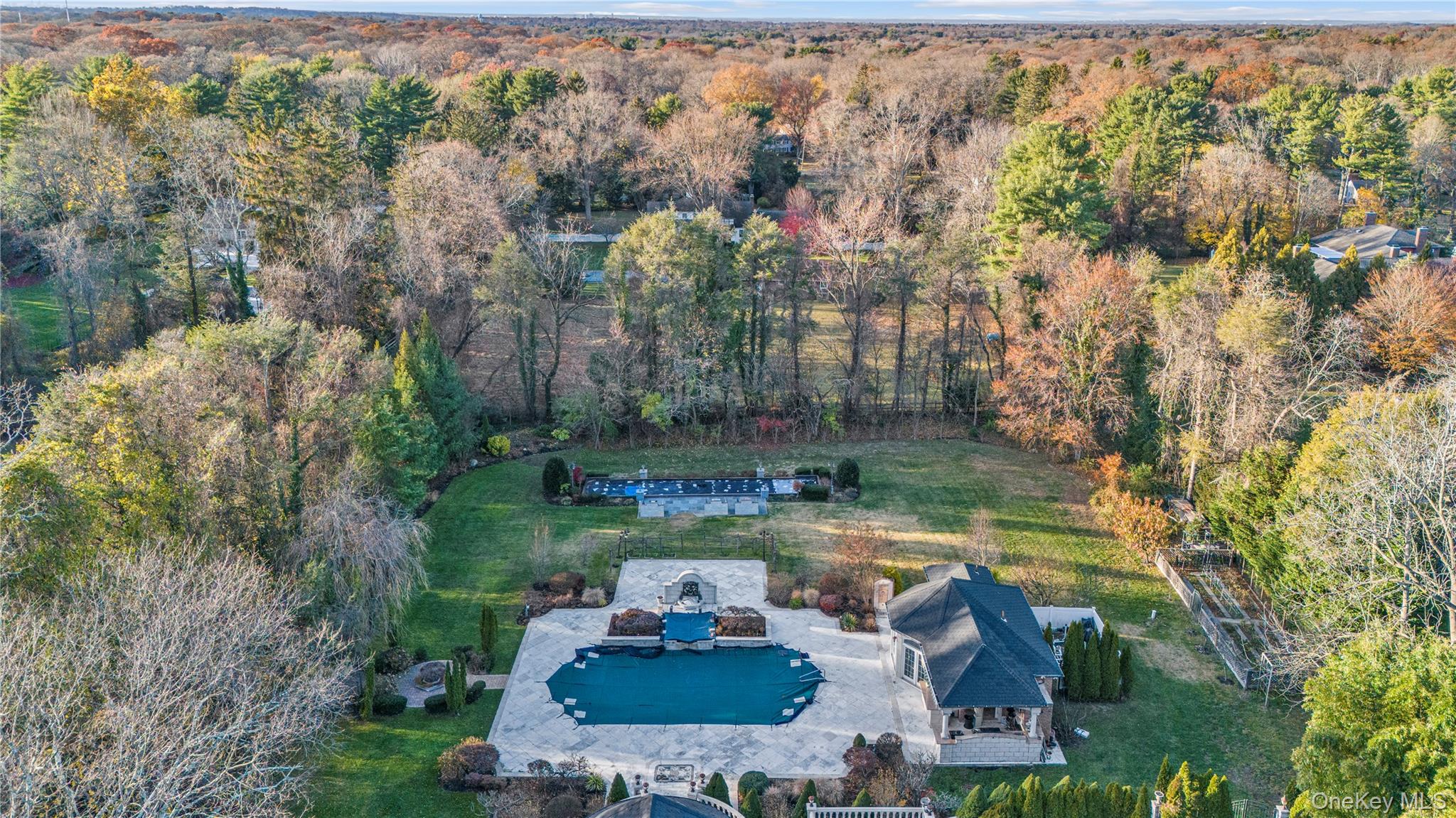 109 Wheatley Road Glen Head, NY 11545 - Photo 10 of 47 an aerial view of a house with swimming pool outdoor seating and yard