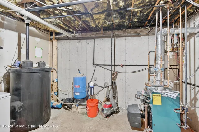 a utility room with multiple dryer and washer