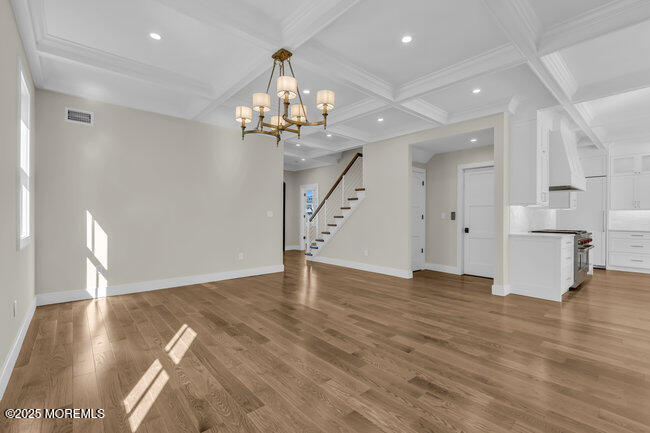 11 Union Avenue Spring Lake, NJ 07762 - Photo 30 of 109 a view of a room with wooden floor staircase and a kitchen