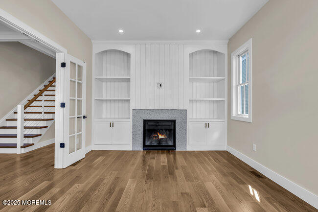 11 Union Avenue Spring Lake, NJ 07762 - Photo 34 of 109 a view of a livingroom with wooden floor and fireplace