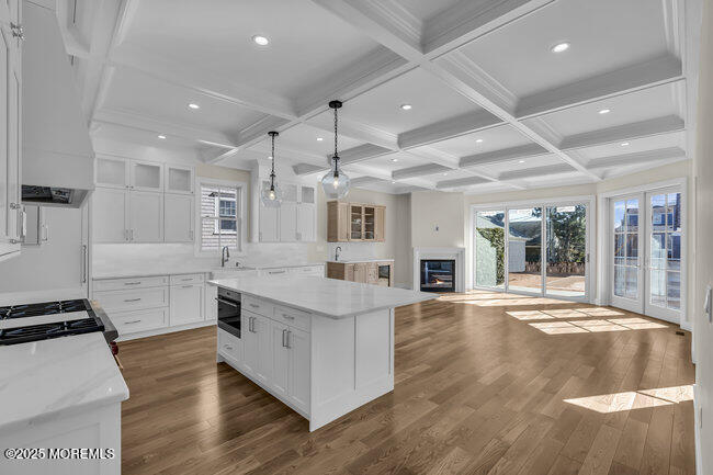 11 Union Avenue Spring Lake, NJ 07762 - Photo 35 of 109 a large kitchen with stainless steel appliances granite countertop a lot of counter space and wooden floor