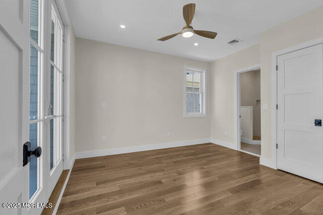 11 Union Avenue Spring Lake, NJ 07762 - Photo 45 of 109 a view of an empty room with wooden floor and a window