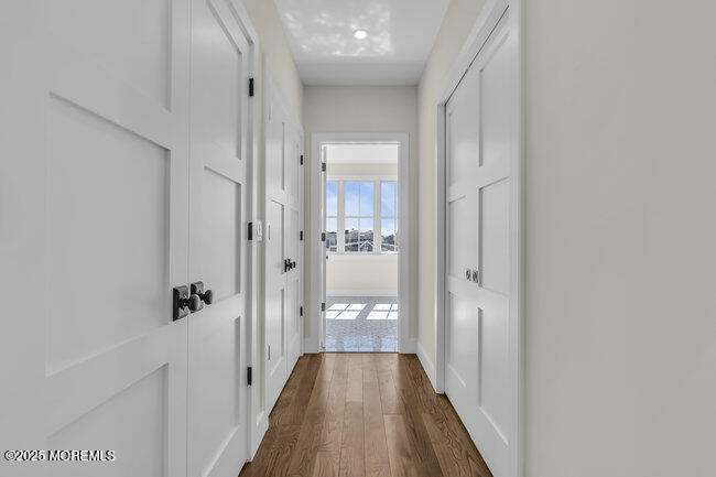 11 Union Avenue Spring Lake, NJ 07762 - Photo 56 of 109 a view of a hallway with wooden floor and a bathroom