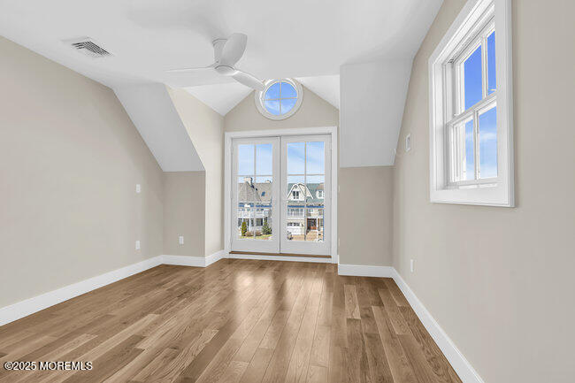 11 Union Avenue Spring Lake, NJ 07762 - Photo 65 of 109 a view of an empty room with wooden floor and a window