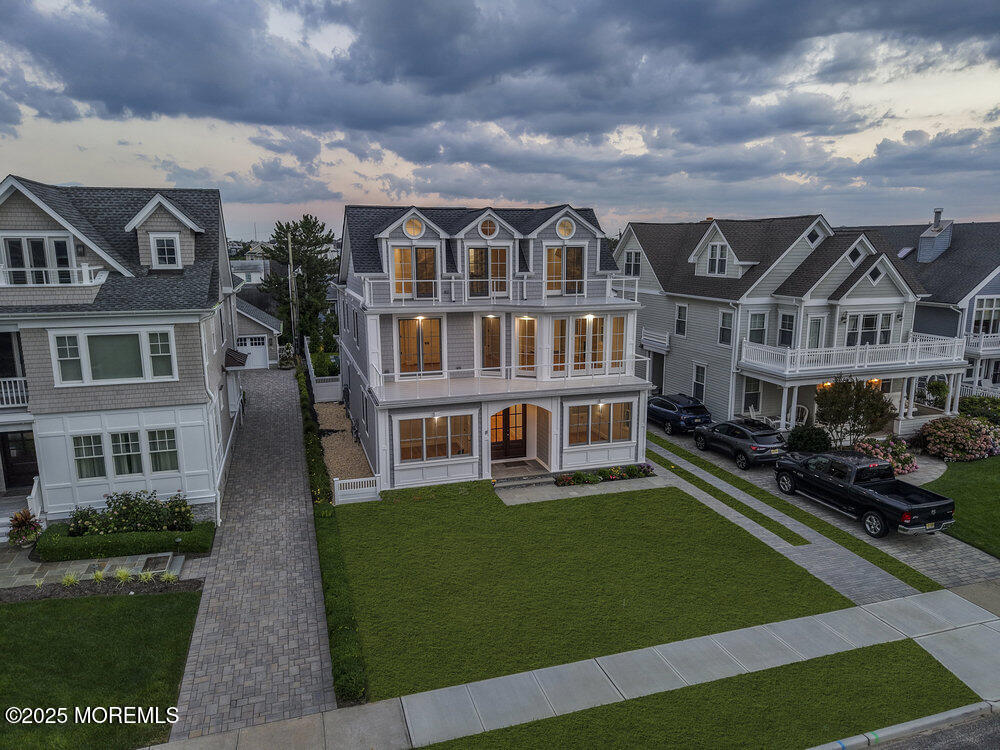 11 Union Avenue Spring Lake, NJ 07762 - Photo 89 of 109 a front view of residential houses with yard and green space