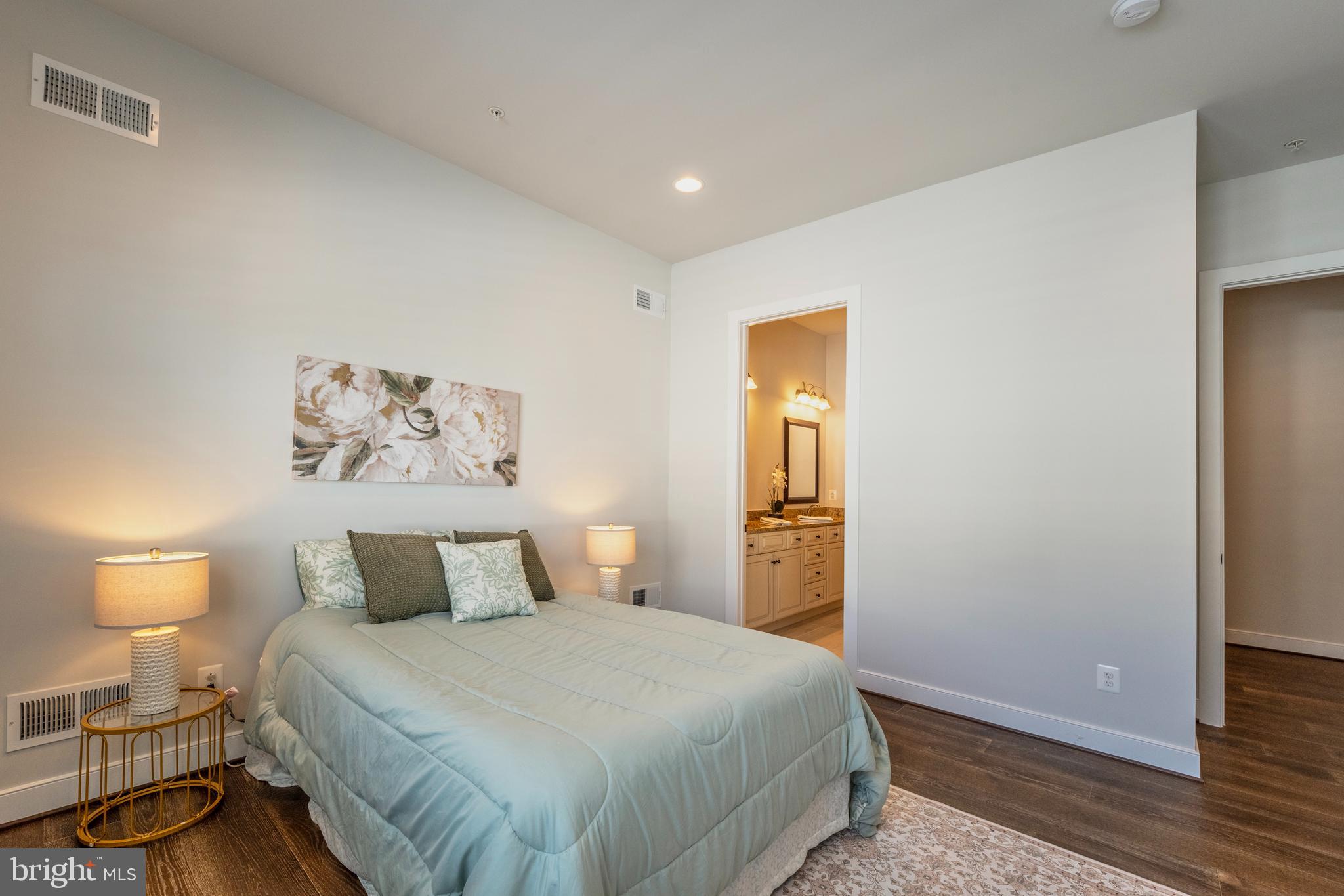 23716 September Sun Square Ashburn, VA 20148 - Photo 19 of 48 a bedroom with a bed and wooden floor