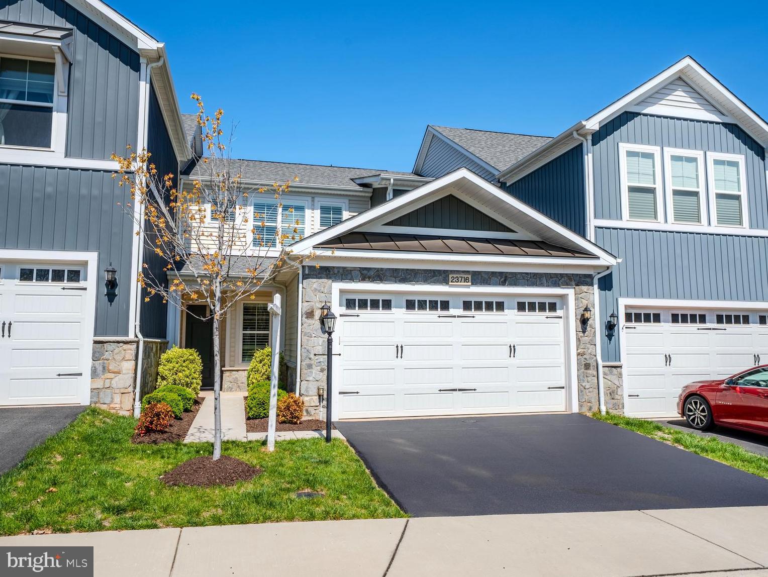 23716 September Sun Square Ashburn, VA 20148 - Photo 2 of 48 a front view of a house with a yard