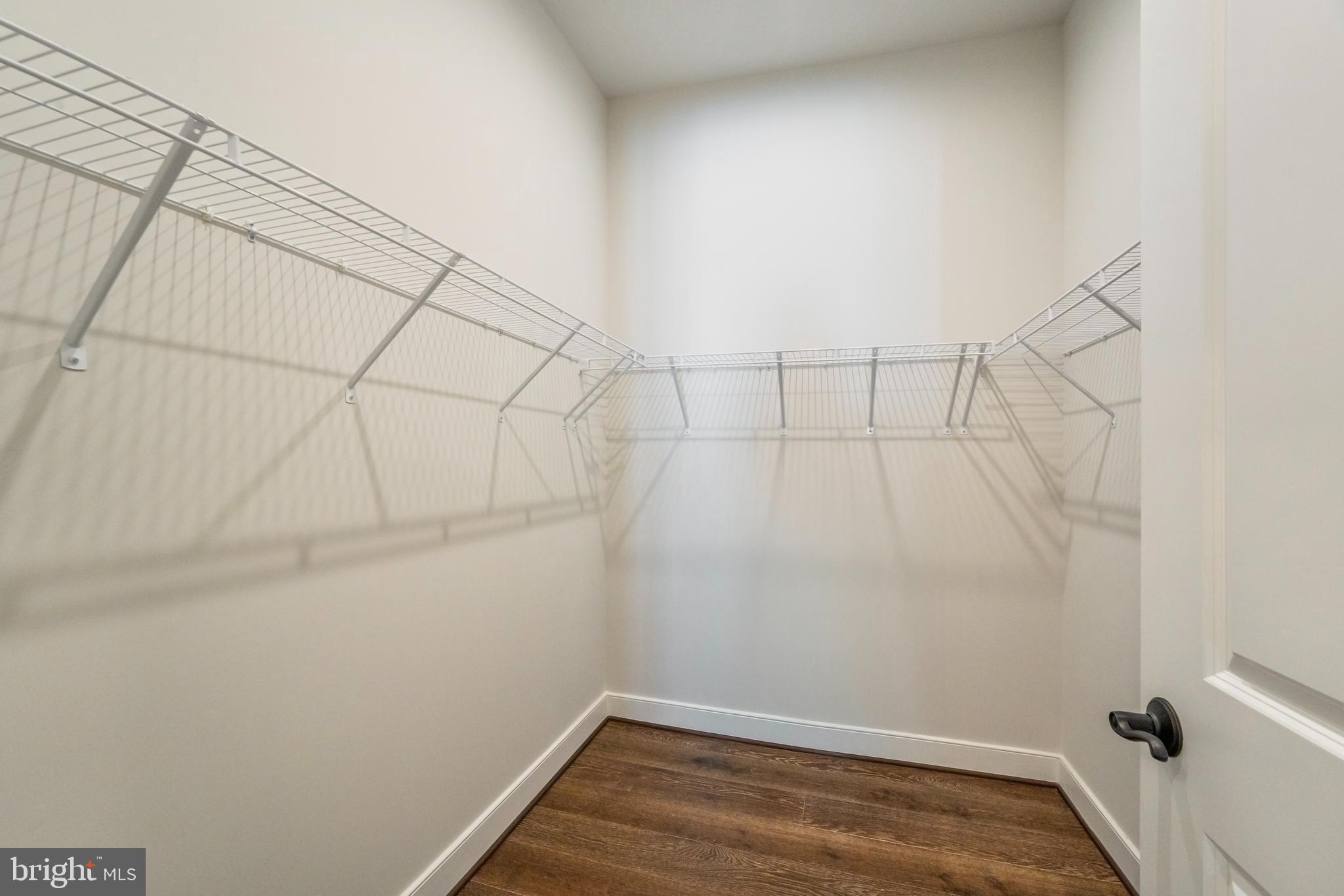 23716 September Sun Square Ashburn, VA 20148 - Photo 22 of 48 a view of a room with racks on the wall