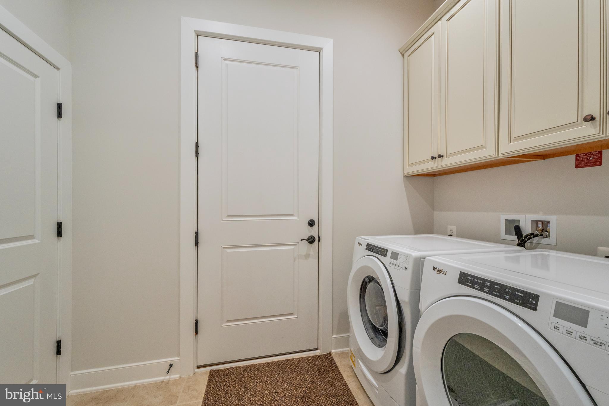 23716 September Sun Square Ashburn, VA 20148 - Photo 25 of 48 a utility room with dryer and washer