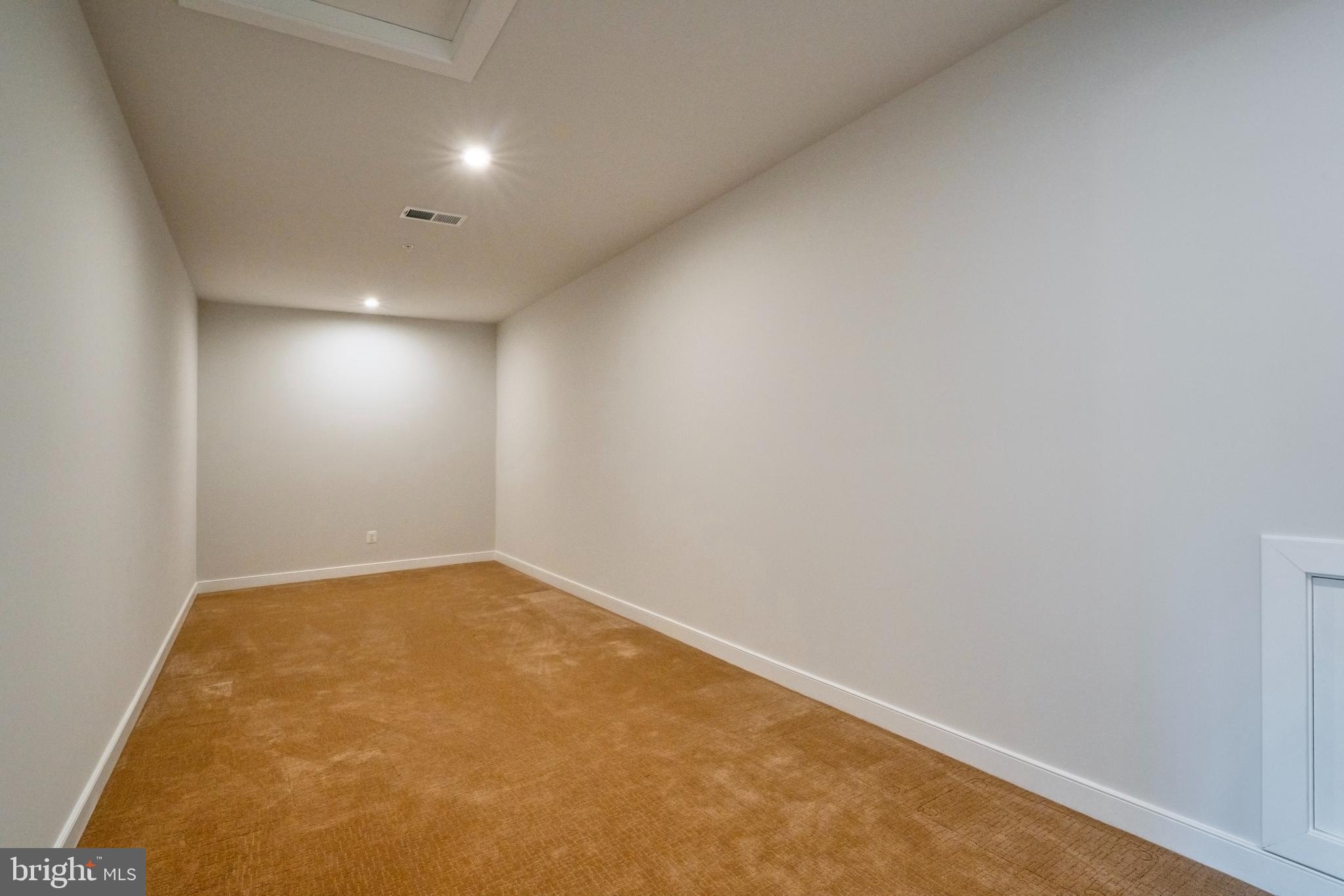 23716 September Sun Square Ashburn, VA 20148 - Photo 28 of 48 an empty room with a workbench