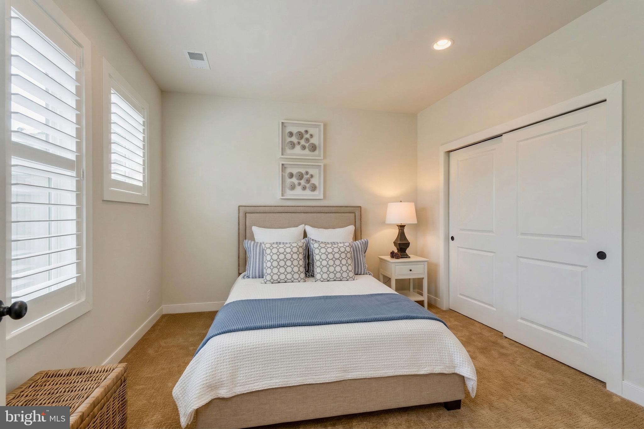 23716 September Sun Square Ashburn, VA 20148 - Photo 30 of 48 a bedroom with a bed and a window with the outer view