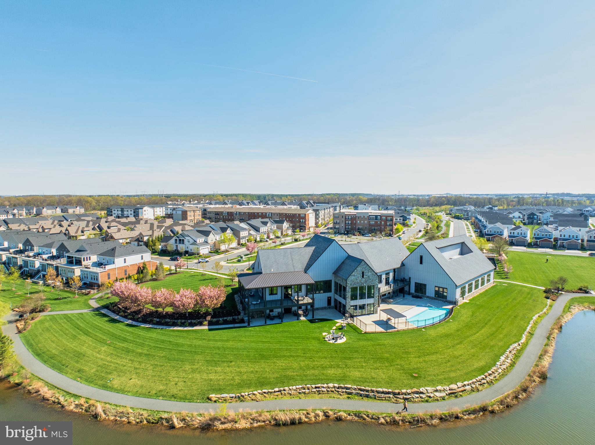 23716 September Sun Square Ashburn, VA 20148 - Photo 43 of 48 an aerial view of a house with a garden and lake view