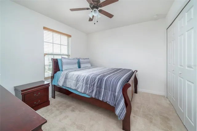 a bedroom with a bed and window