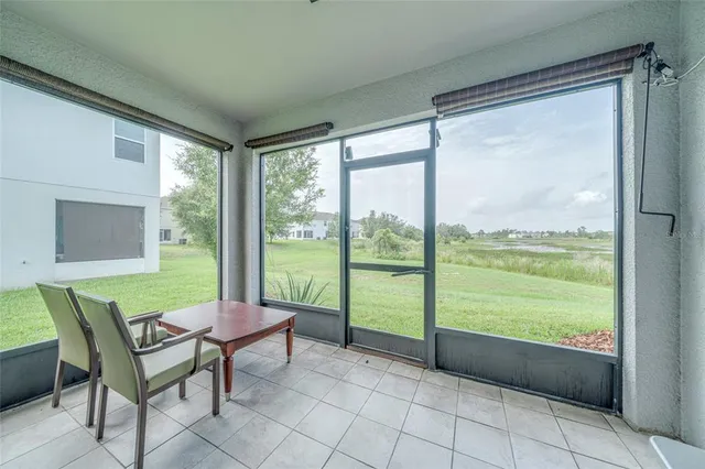 a view of a room that has a bed and a chair