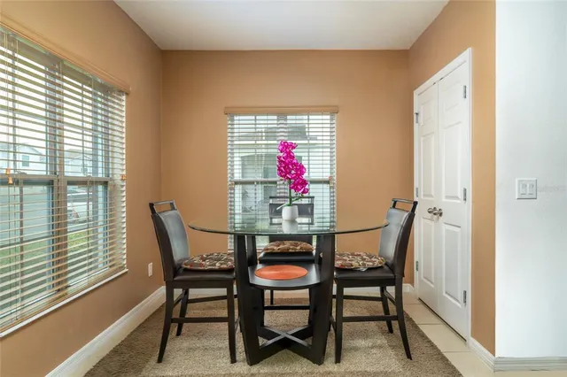 a view of a dining room with furniture and window