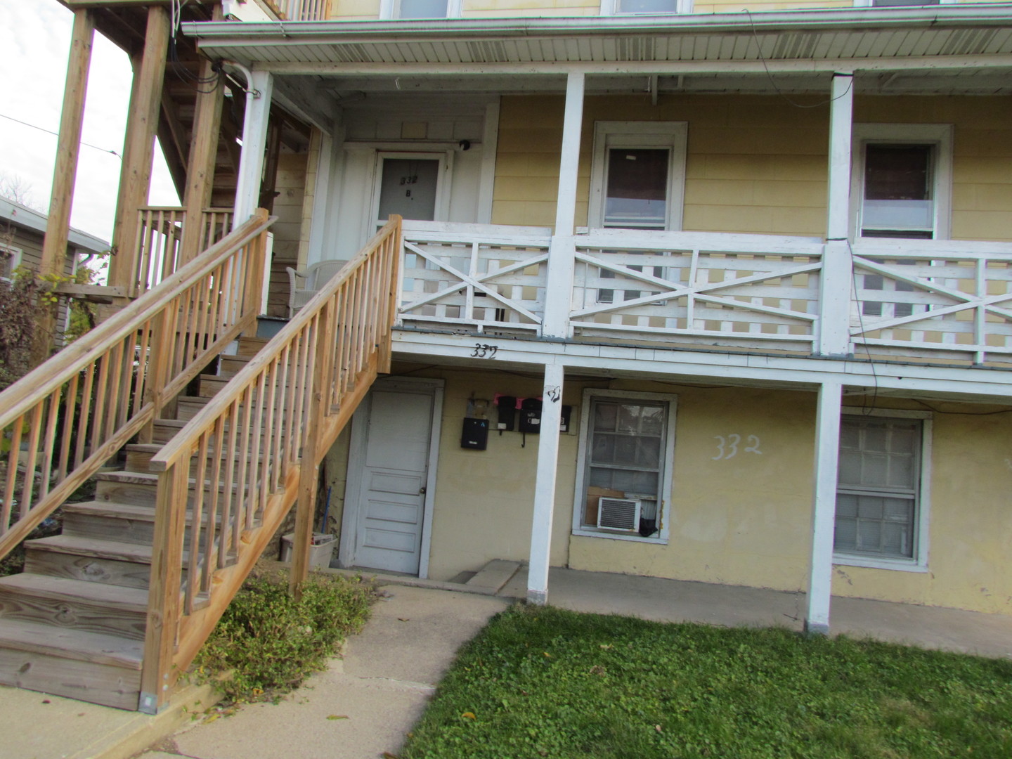 332 South Broadway Aurora, IL 60505 - Photo 3 of 9 a front view of a house with glass windows and stairs