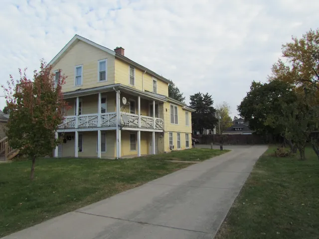a view of backyard with outdoor seating