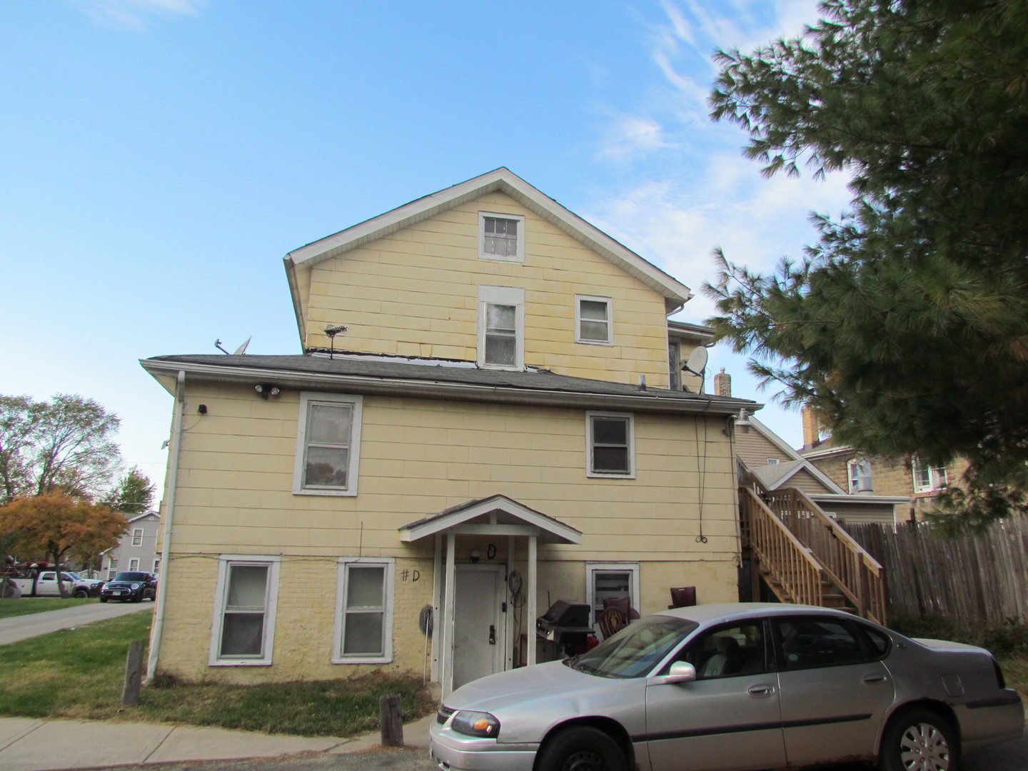 332 South Broadway Aurora, IL 60505 - Photo 9 of 9 a view of a house with a cars park side of a road