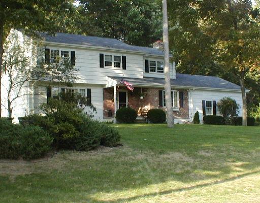 9 Green Haven Road Trumbull, CT 06611 - Photo 1 of 1 a front view of a house with a yard and trees