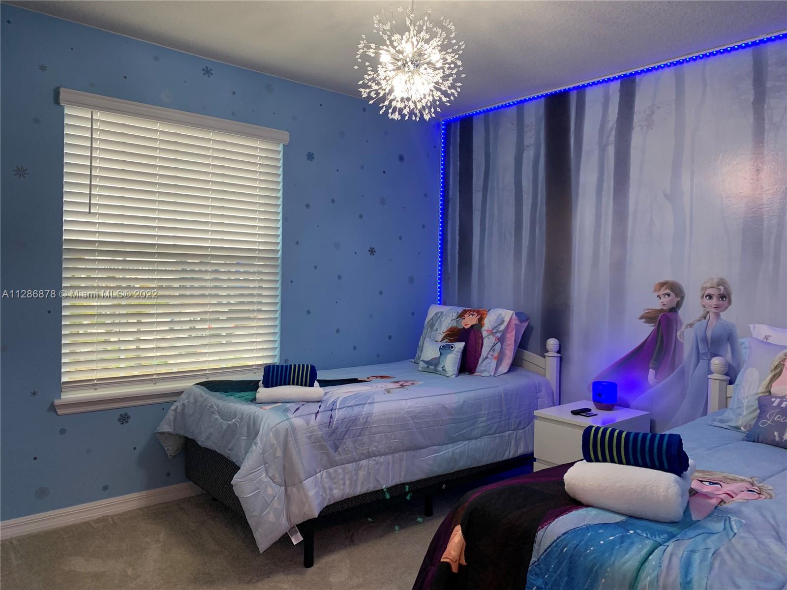 7108 Oakmoss Loop Davenport, FL 33837 - Photo 13 of 20 a bedroom with bed and a window