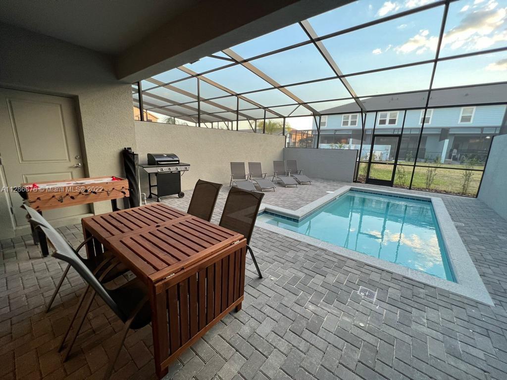 7108 Oakmoss Loop Davenport, FL 33837 - Photo 20 of 20 a view of an outdoor space with sitting area