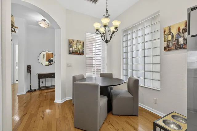 a kitchen with stainless steel appliances granite countertop a refrigerator a sink and a stove