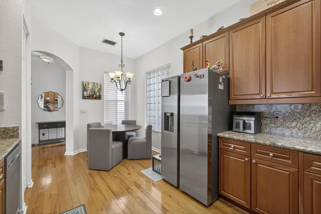 a room with pool table and windows