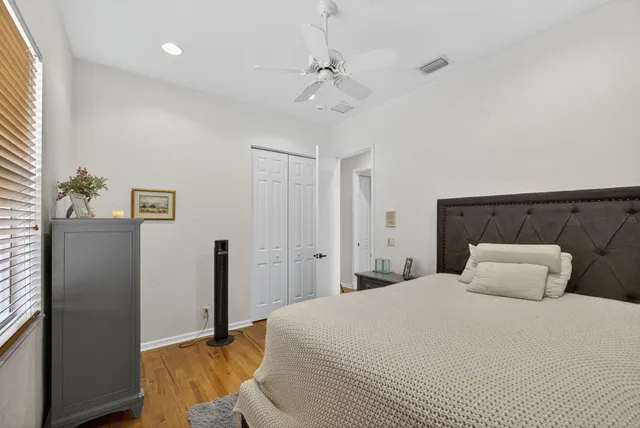 a bedroom with two beds and a lamp