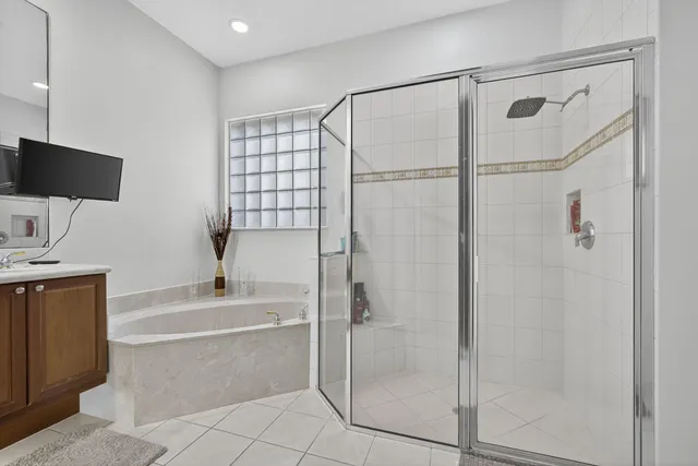 a house that has a tree in front of the house