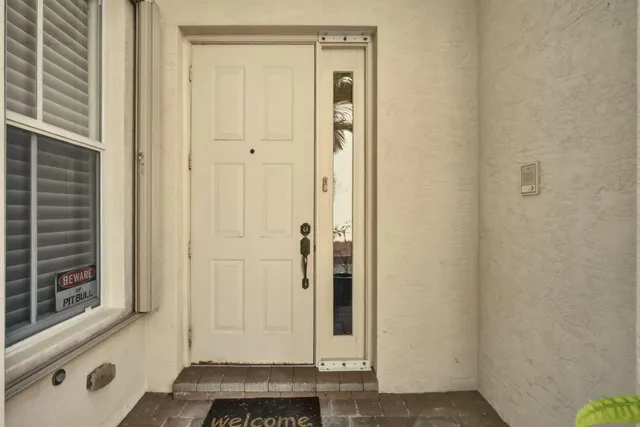 a view of a room with wooden floor and window