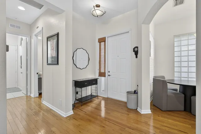 a large kitchen with stainless steel appliances granite countertop a refrigerator sink and cabinets