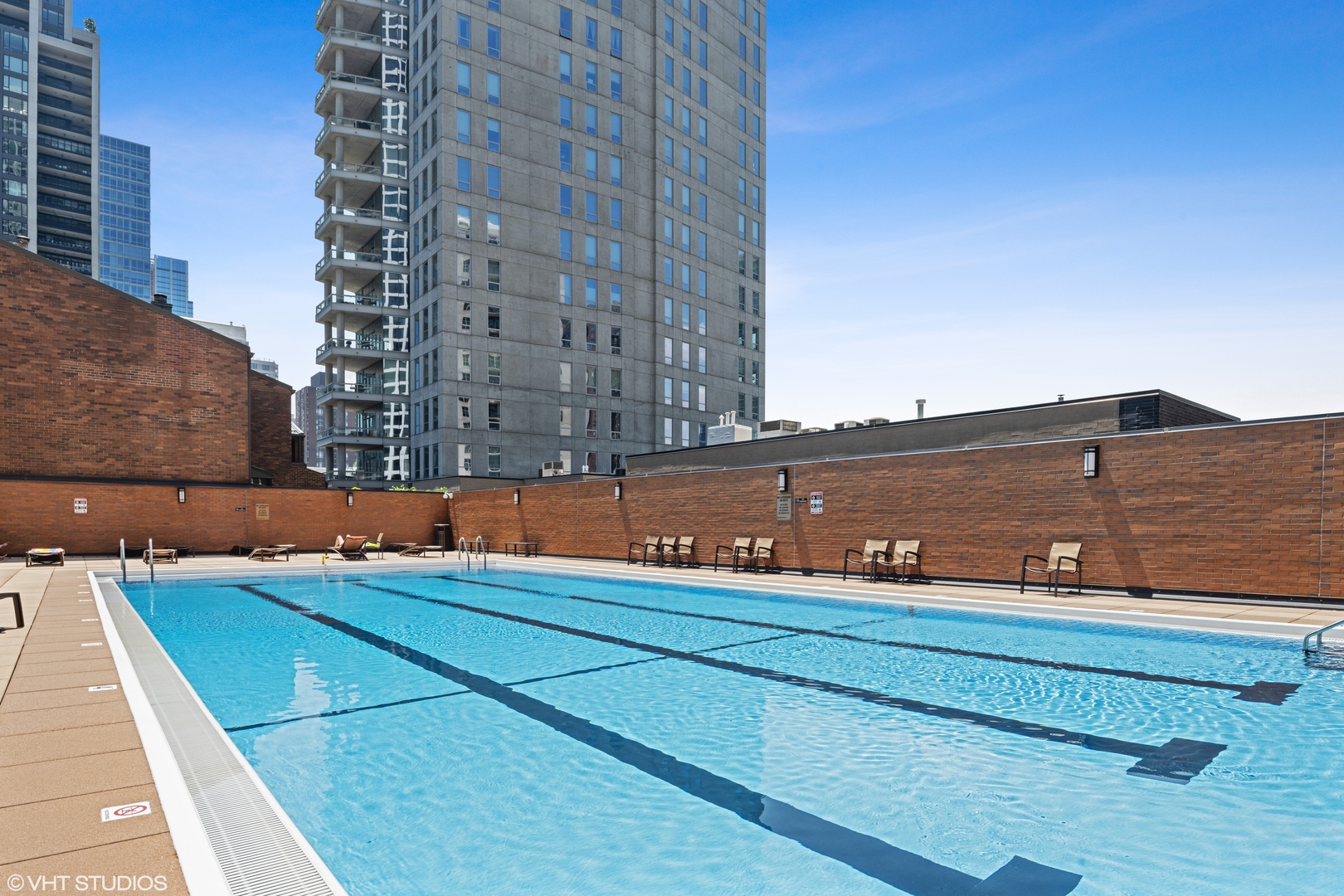 1030 North State Street, Unit 9K Chicago, IL 60610 - Photo 12 of 12 a view of a tennis court with building exterior