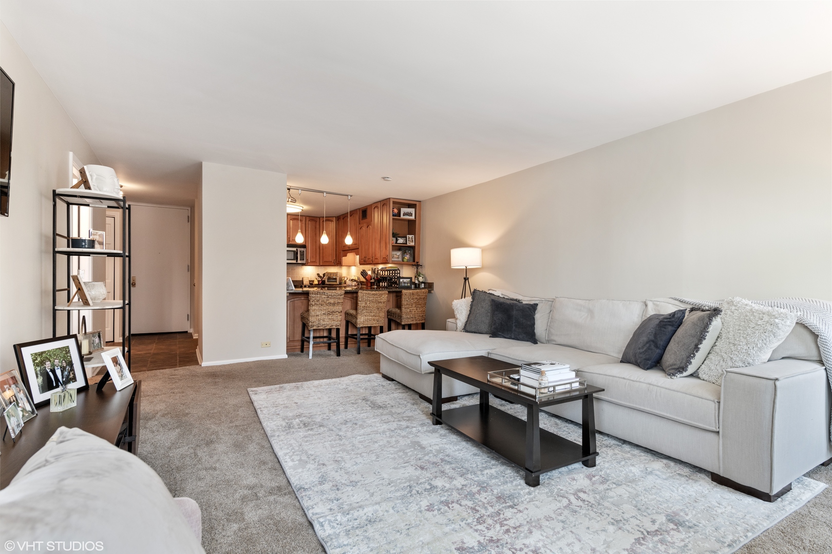 1030 North State Street, Unit 9K Chicago, IL 60610 - Photo 2 of 12 a living room with furniture and a wooden floor