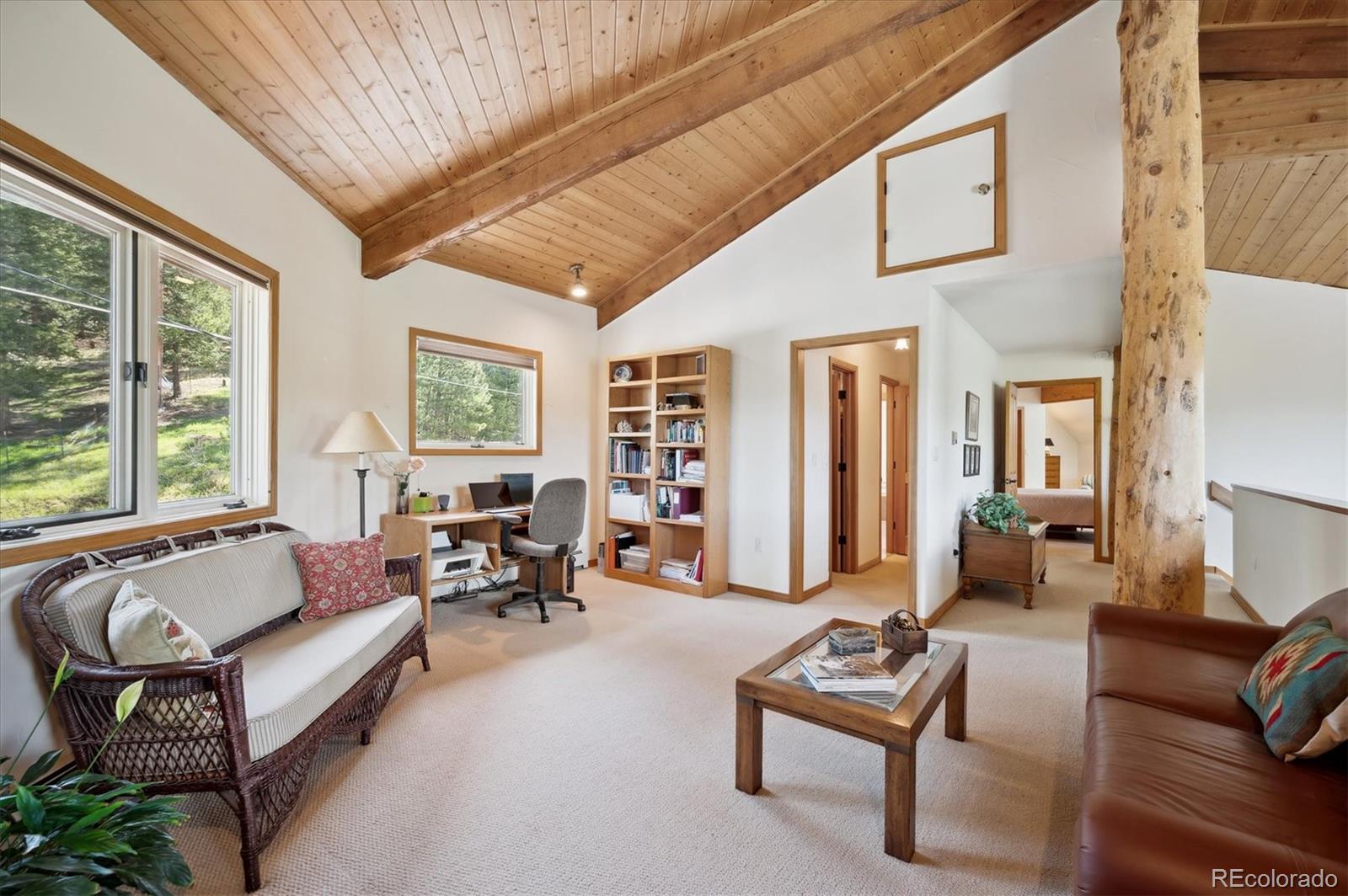 4671 Independence Trail Evergreen, CO 80439 - Photo 13 of 39 a living room with furniture and a large window