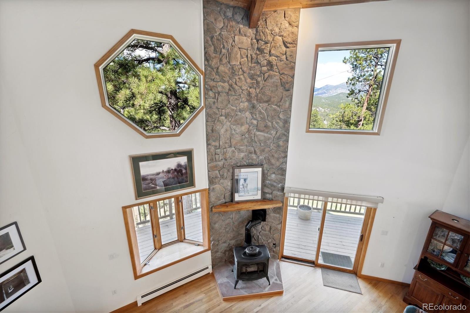 4671 Independence Trail Evergreen, CO 80439 - Photo 14 of 39 a view of a workspace with furniture and a window