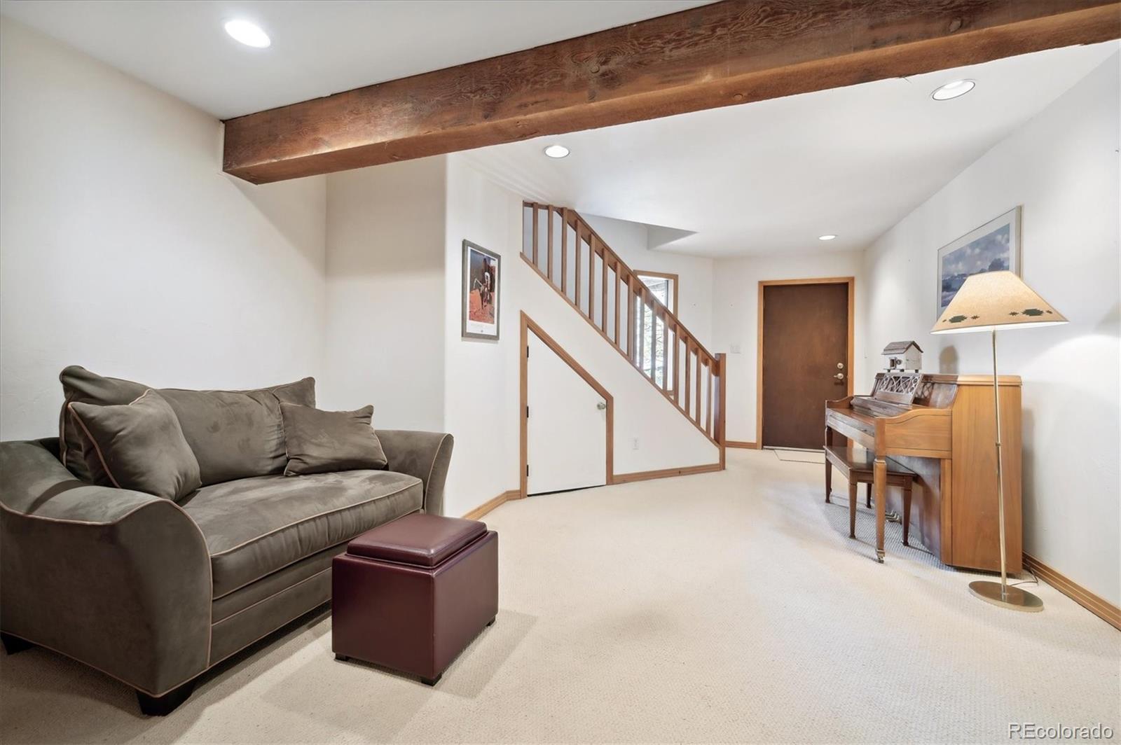 4671 Independence Trail Evergreen, CO 80439 - Photo 21 of 39 a living room with furniture and a dining table