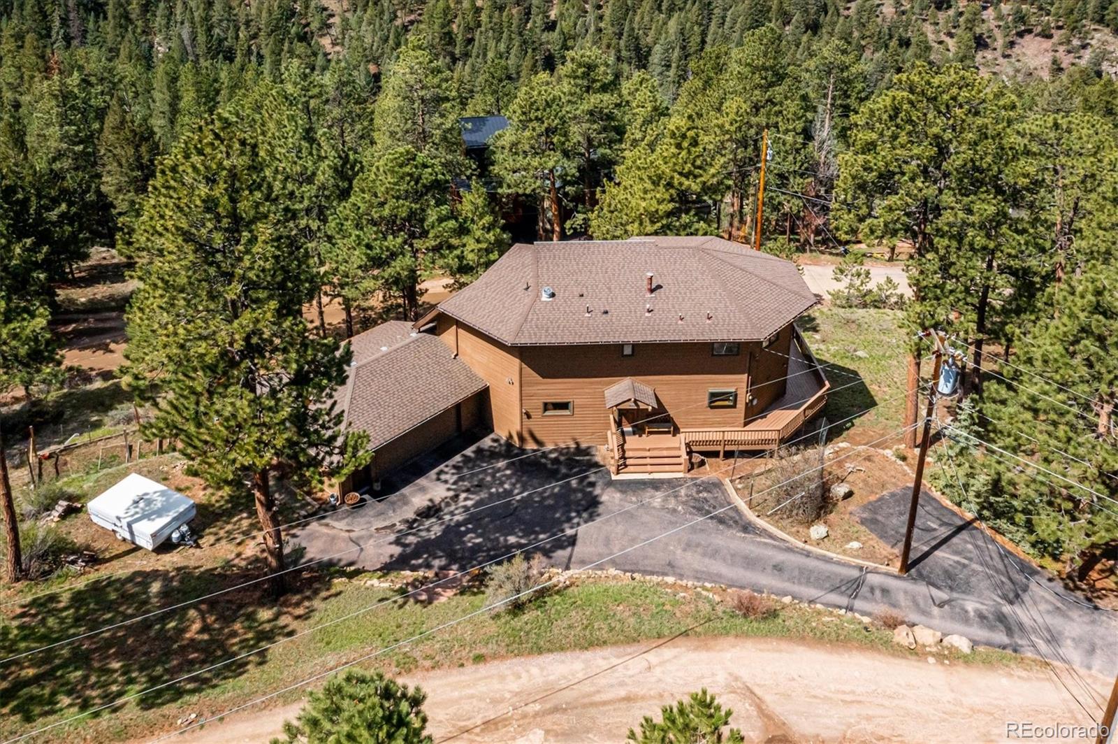 4671 Independence Trail Evergreen, CO 80439 - Photo 28 of 39 an aerial view of a house with yard and outdoor seating