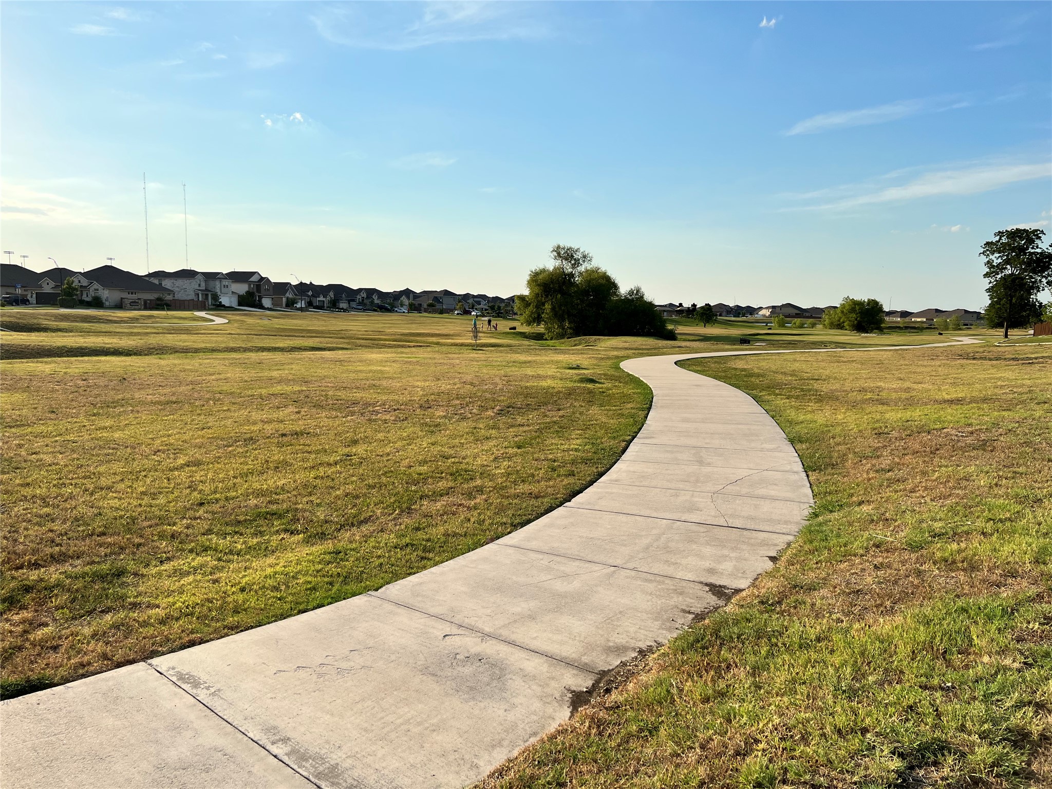 140 Pentro Path Georgetown, TX 78626 - Photo 35 of 37 A winding pathway invites leisurely strolls through the community green space.