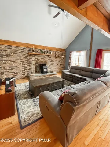 a living room with furniture and a rug
