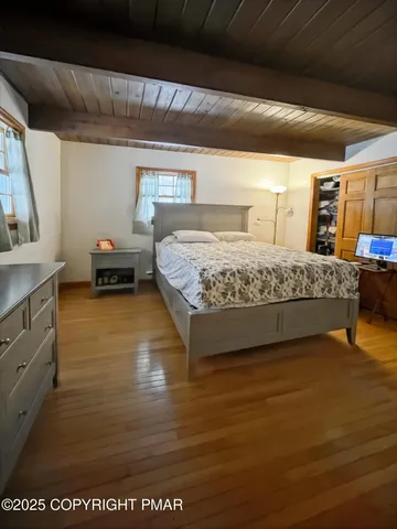 a bed sitting in a room next to a window
