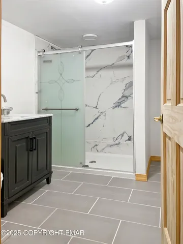 a bathroom with a toilet a sink and a window