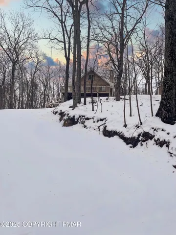 a view of covered with snow in front of house