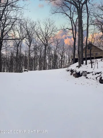 a view of snow on the road