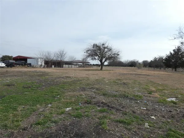 a view of a lake with a yard