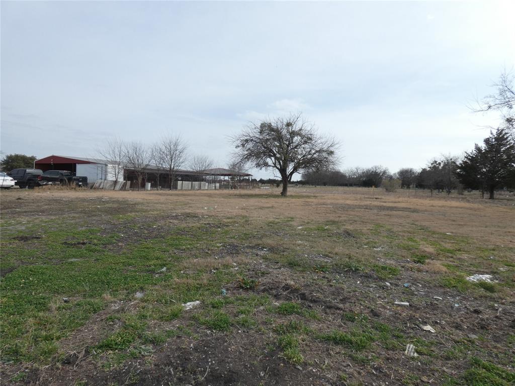 632 East Reindeer Road Lancaster, TX 75146 - Photo 14 of 24 a view of a field with trees in background